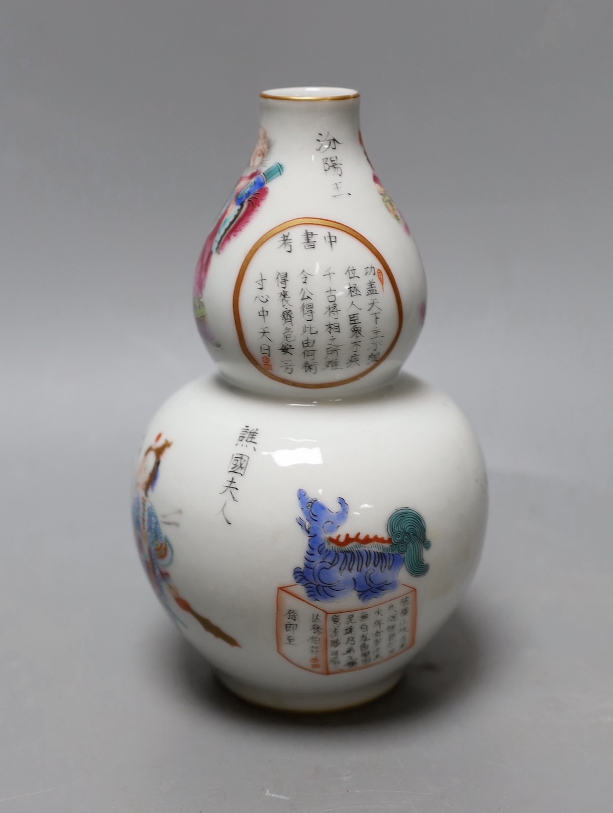 A Chinese famille rose gourd vase. 18cm high